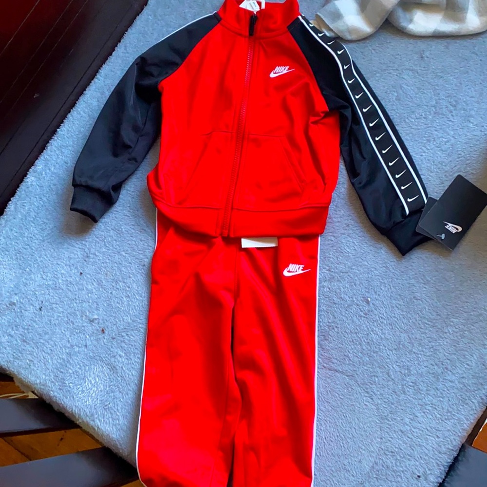 University Red Nike jacket with pants never worn with tags still on!